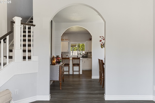 227 Hauser Ct, Molalla, OR 97038 - corridor with dark wood finished floors, stairs, and baseboards