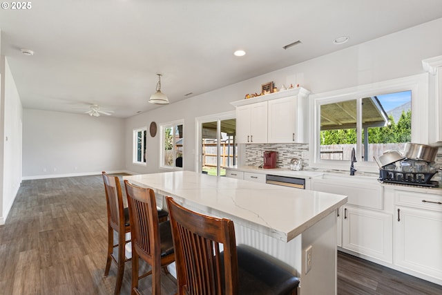 227 Hauser Ct, Molalla, OR 97038 - kitchen with a kitchen island, dishwasher, dark wood-style floors, healthy amount of natural light, and recessed lighting