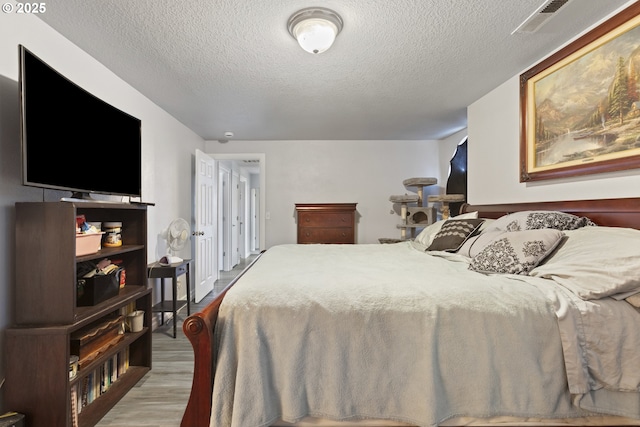 227 Hauser Ct, Molalla, OR 97038 - bedroom with wood finished floors and a textured ceiling