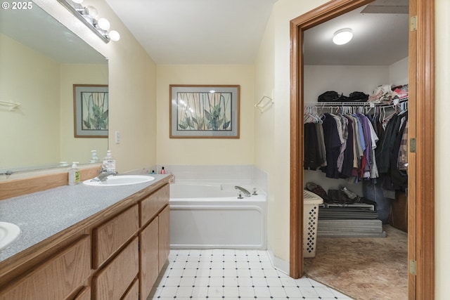 227 Hauser Ct, Molalla, OR 97038 - full bathroom featuring a garden tub, tile patterned floors, double vanity, and a spacious closet