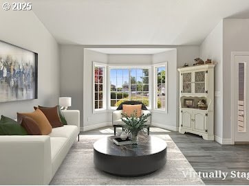 227 Hauser Ct, Molalla, OR 97038 - living room with wood finished floors, baseboards, and vaulted ceiling