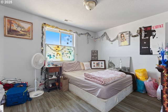 227 Hauser Ct, Molalla, OR 97038 - bedroom featuring wood finished floors and a textured ceiling