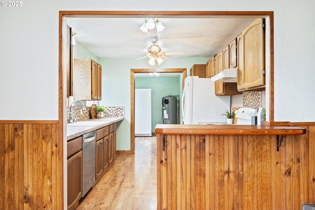 11754 Colvin Rd, Clatskanie, OR 97016 - kitchen with a sink, freestanding refrigerator, dishwasher, water heater, and a peninsula