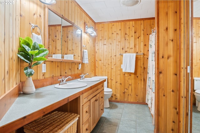 11754 Colvin Rd, Clatskanie, OR 97016 - bathroom with toilet, wooden walls, double vanity, and baseboards