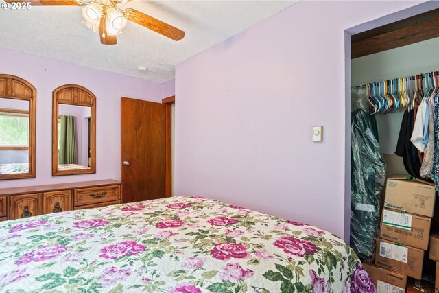 11754 Colvin Rd, Clatskanie, OR 97016 - bedroom featuring a textured ceiling and a ceiling fan