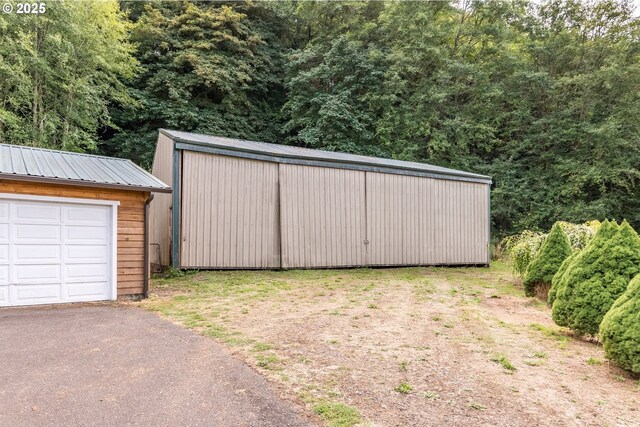 11754 Colvin Rd, Clatskanie, OR 97016 - view of yard featuring an outbuilding and asphalt driveway