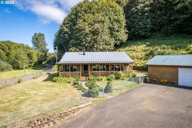 11754 Colvin Rd, Clatskanie, OR 97016 - view of front of home with a porch, a gate, and metal roof