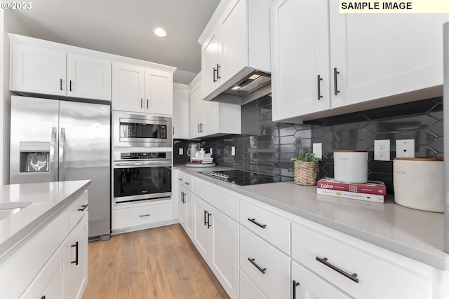 8518 NE 134th Ave Lot 89, Vancouver, WA 98682 - kitchen featuring appliances with stainless steel finishes, tasteful backsplash, light countertops, white cabinets, and recessed lighting