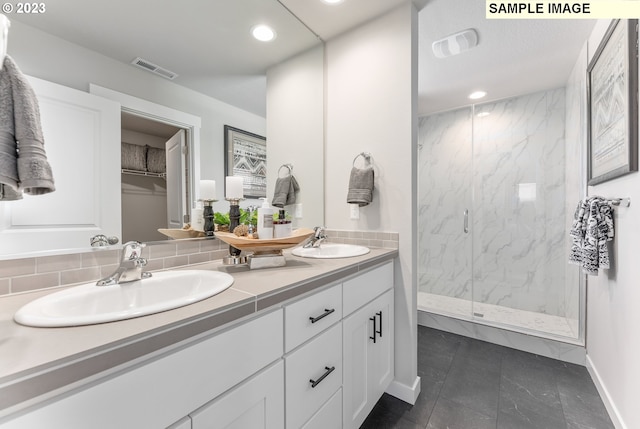 8518 NE 134th Ave Lot 89, Vancouver, WA 98682 - bathroom with a marble finish shower, double vanity, recessed lighting, tile patterned flooring, and baseboards