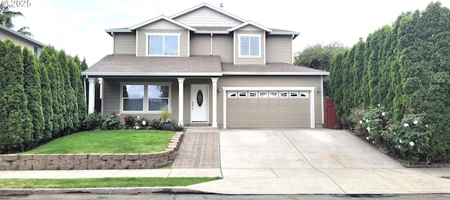 2659 SW Latourell Pl SW, Troutdale, OR 97060 - view of front of house with an attached garage, concrete driveway, a front yard, covered porch, and roof with shingles