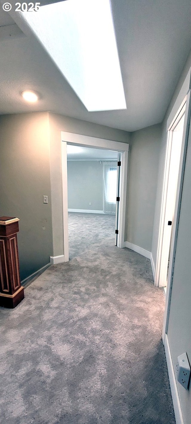 2659 SW Latourell Pl SW, Troutdale, OR 97060 - hall featuring carpet floors, baseboards, and a skylight