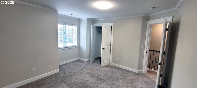 2659 SW Latourell Pl SW, Troutdale, OR 97060 - unfurnished bedroom with ornamental molding, carpet flooring, baseboards, a textured ceiling, and a closet