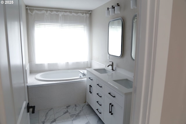 2659 SW Latourell Pl SW, Troutdale, OR 97060 - bathroom featuring marble look tiles, a bath, and double vanity
