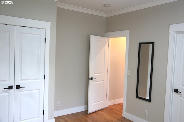2659 SW Latourell Pl SW, Troutdale, OR 97060 - unfurnished bedroom with light wood-style flooring, crown molding, baseboards, and a closet
