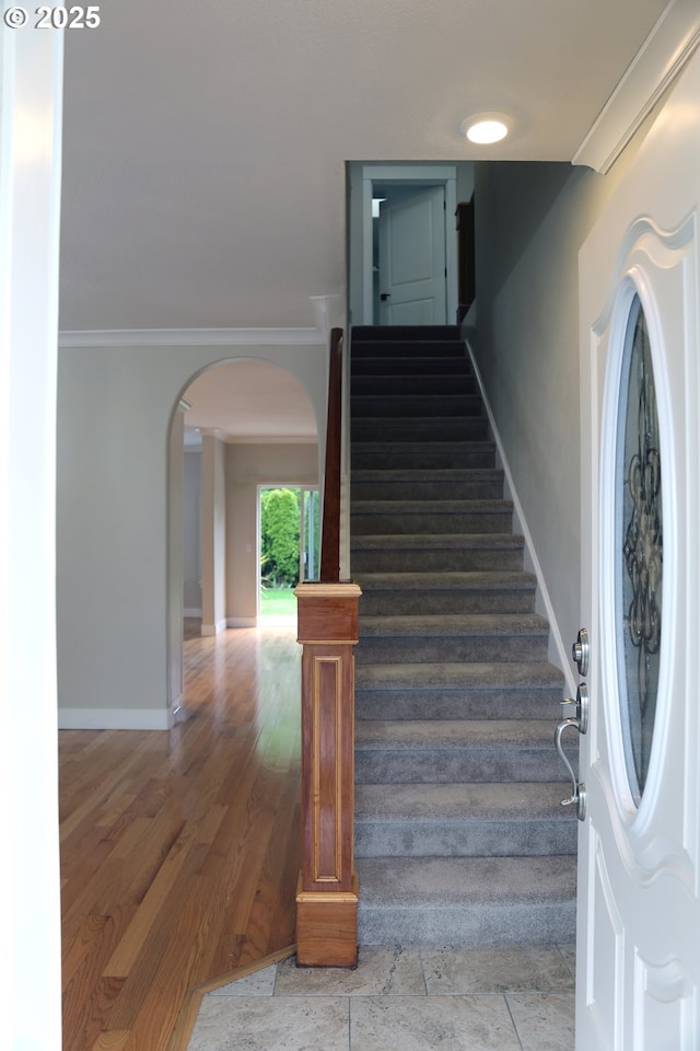 2659 SW Latourell Pl SW, Troutdale, OR 97060 - staircase with arched walkways, crown molding, baseboards, and wood finished floors