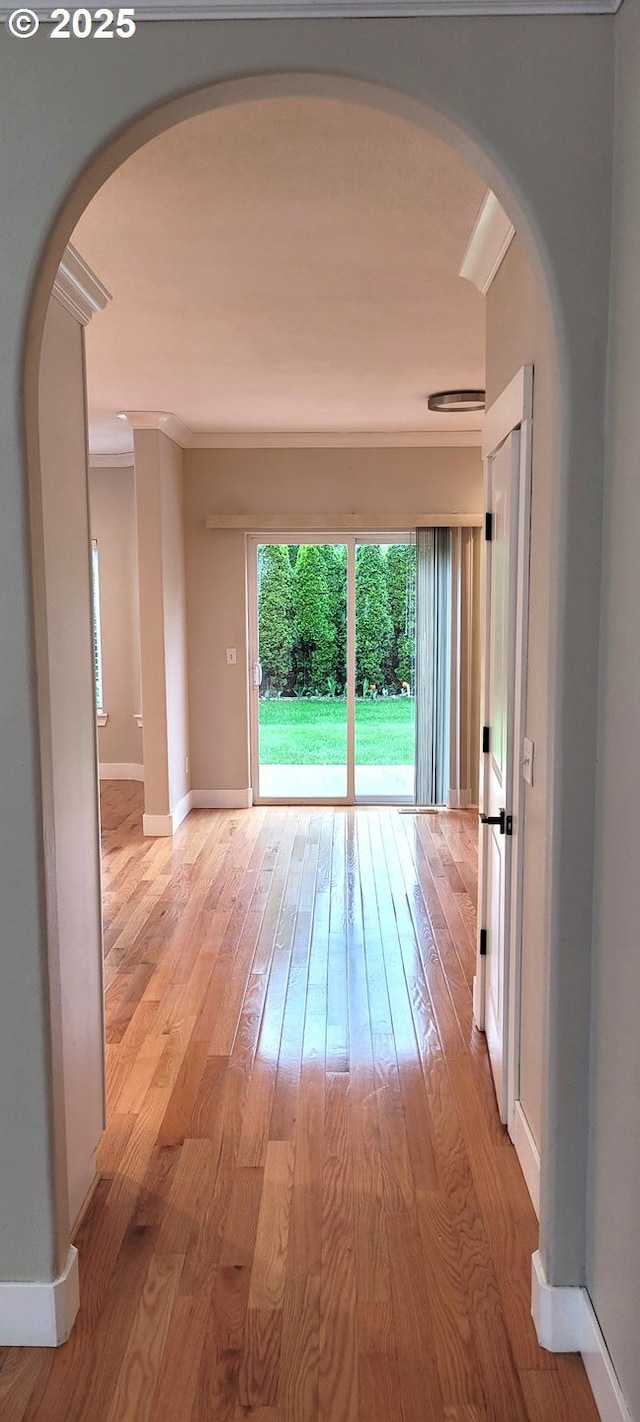 2659 SW Latourell Pl SW, Troutdale, OR 97060 - spare room with arched walkways, light wood-type flooring, baseboards, and crown molding