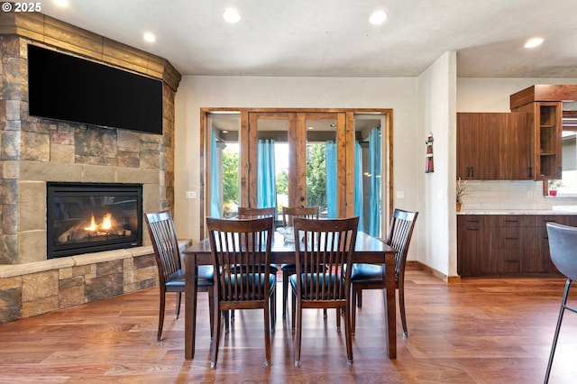 1025 Echo Dr, Roseburg, OR 97470 - dining room featuring wood finished floors, recessed lighting, and a fireplace