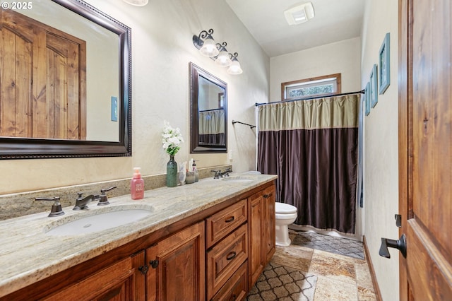 1025 Echo Dr, Roseburg, OR 97470 - bathroom featuring stone tile flooring, double vanity, and a shower with shower curtain