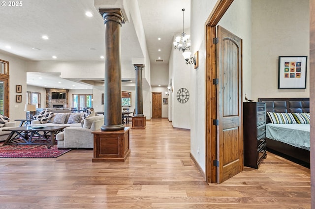 1025 Echo Dr, Roseburg, OR 97470 - living area with ornate columns, light wood-style flooring, and recessed lighting