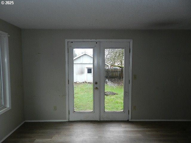 entryway with hardwood / wood-style floors