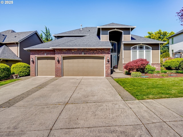 view of front of property with a front lawn, brick siding, roof with shingles, concrete driveway, and an attached garage