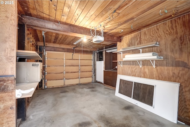 garage with a garage door opener and wood ceiling