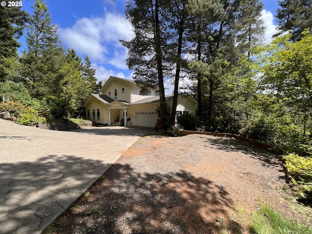 5816 Martin Rd, Florence, OR 97439 - view of front facade with concrete driveway and a garage