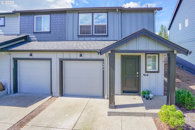 2804 N 3rd Way, Ridgefield, WA 98642 - townhome / multi-family property with board and batten siding, driveway, roof with shingles, and an attached garage