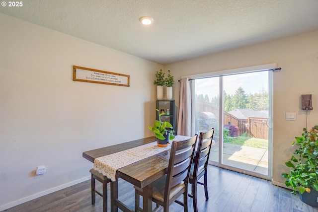 2804 N 3rd Way, Ridgefield, WA 98642 - dining space with baseboards, dark wood finished floors, recessed lighting, and a textured ceiling