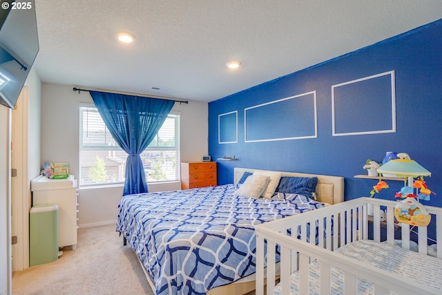 2804 N 3rd Way, Ridgefield, WA 98642 - bedroom with carpet, baseboards, a textured ceiling, and recessed lighting