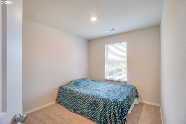 2804 N 3rd Way, Ridgefield, WA 98642 - carpeted bedroom featuring baseboards and a textured ceiling