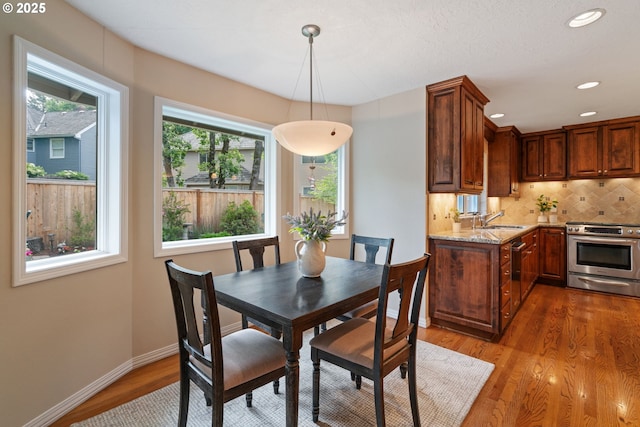 14230 Amberwood Cir, Lake Oswego, OR 97035 - dining room with wood finished floors, baseboards, and recessed lighting