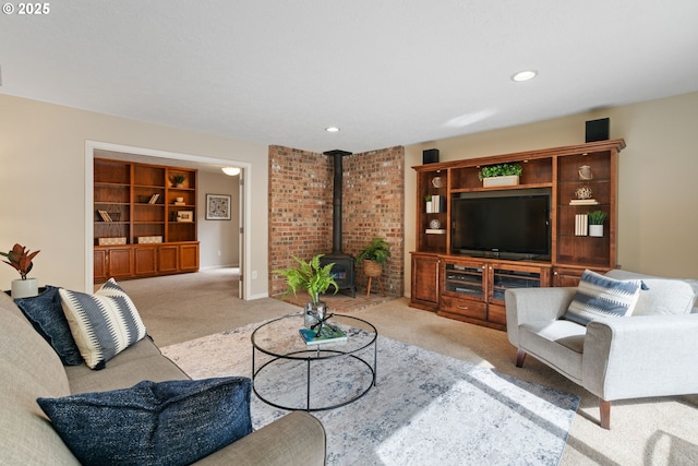 14230 Amberwood Cir, Lake Oswego, OR 97035 - living area featuring carpet flooring, a wood stove, and recessed lighting