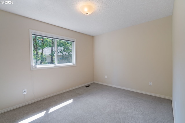 14230 Amberwood Cir, Lake Oswego, OR 97035 - carpeted spare room with a textured ceiling and baseboards