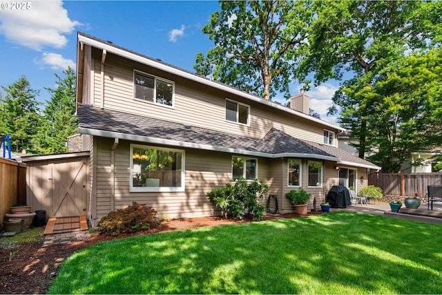 14230 Amberwood Cir, Lake Oswego, OR 97035 - back of property with a chimney, a patio area, and roof with shingles