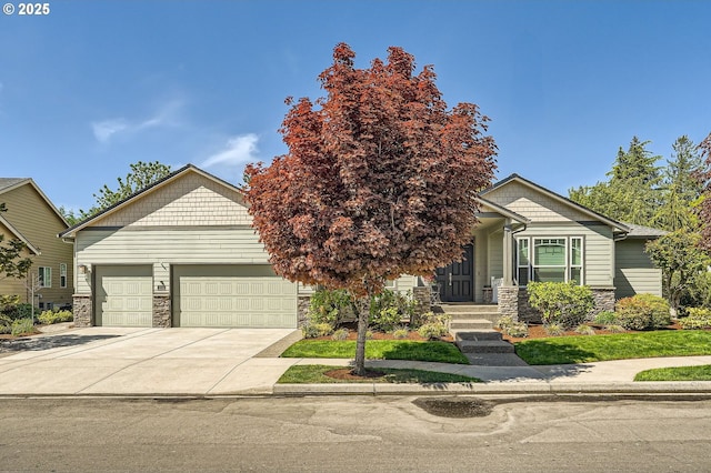 1114 S 6th Way, Ridgefield, WA 98642 - view of front facade featuring stone siding, an attached garage, and driveway