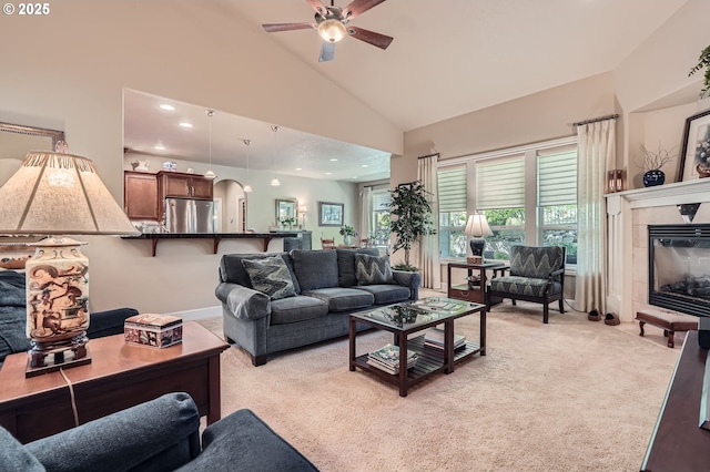 1114 S 6th Way, Ridgefield, WA 98642 - living area featuring light carpet, ceiling fan, a tile fireplace, recessed lighting, and high vaulted ceiling