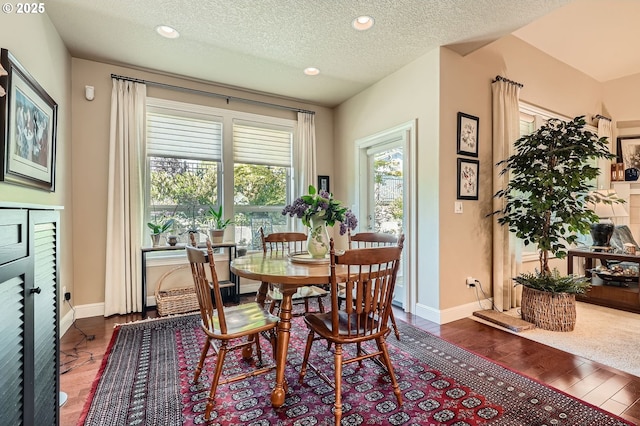 1114 S 6th Way, Ridgefield, WA 98642 - dining room featuring dark wood-type flooring, baseboards, recessed lighting, and a textured ceiling