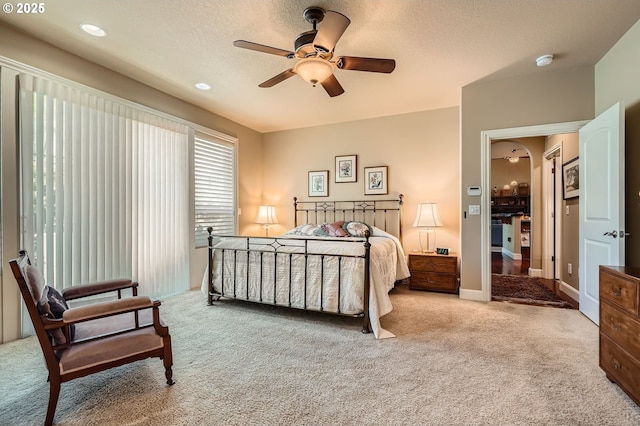 1114 S 6th Way, Ridgefield, WA 98642 - bedroom with carpet floors, arched walkways, a textured ceiling, and ceiling fan