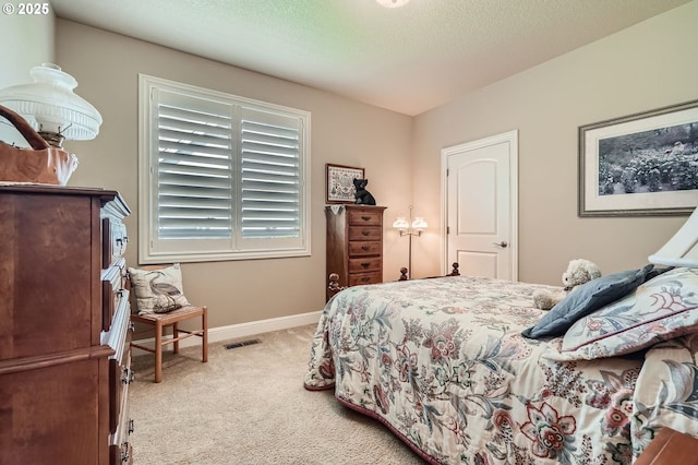 1114 S 6th Way, Ridgefield, WA 98642 - carpeted bedroom featuring baseboards and a textured ceiling