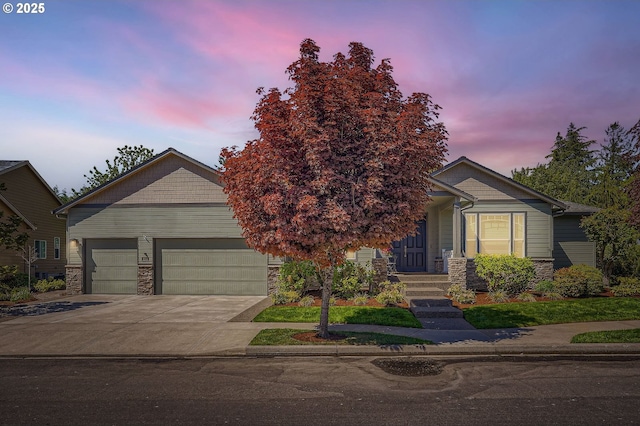 1114 S 6th Way, Ridgefield, WA 98642 - view of front of home featuring stone siding, concrete driveway, and an attached garage