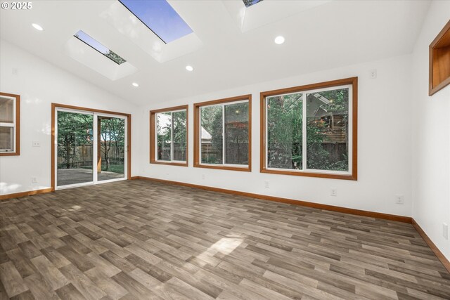 65277 E Sandy River Ln, Rhododendron, OR 97049 - empty room with a skylight, recessed lighting, wood finished floors, lofted ceiling, and baseboards