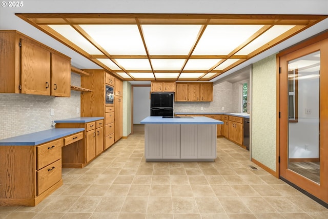 65277 E Sandy River Ln, Rhododendron, OR 97049 - kitchen featuring black appliances, backsplash, open shelves, brown cabinets, and a kitchen island