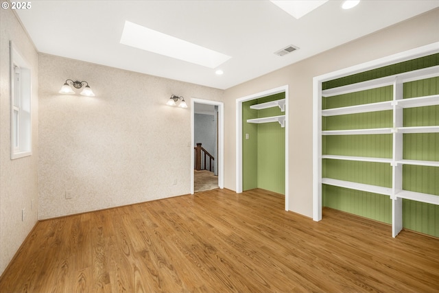 65277 E Sandy River Ln, Rhododendron, OR 97049 - unfurnished bedroom featuring a skylight, wood finished floors, and recessed lighting