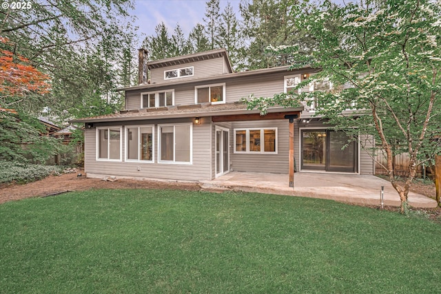 65277 E Sandy River Ln, Rhododendron, OR 97049 - rear view of house with a patio and a chimney