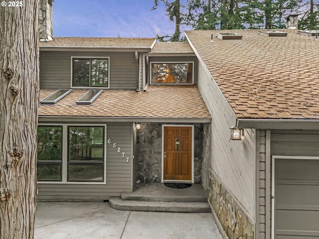 65277 E Sandy River Ln, Rhododendron, OR 97049 - entrance to property with stone siding and roof with shingles