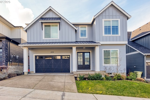 view of front of home with a garage and a front yard