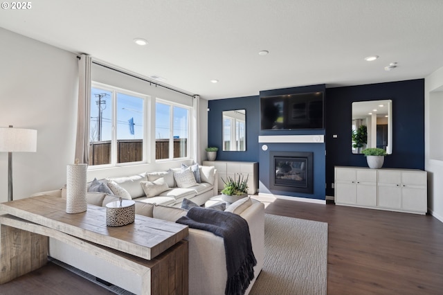 974 Legacy Ln, Eugene, OR 97402 - living room with a glass covered fireplace, dark wood finished floors, and recessed lighting