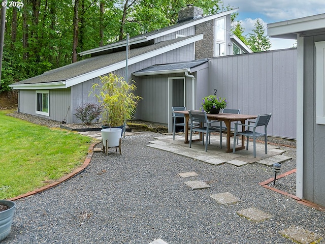 1339 NW 7th Ave, Camas, WA 98607 - back of house featuring a patio area, a chimney, and a yard
