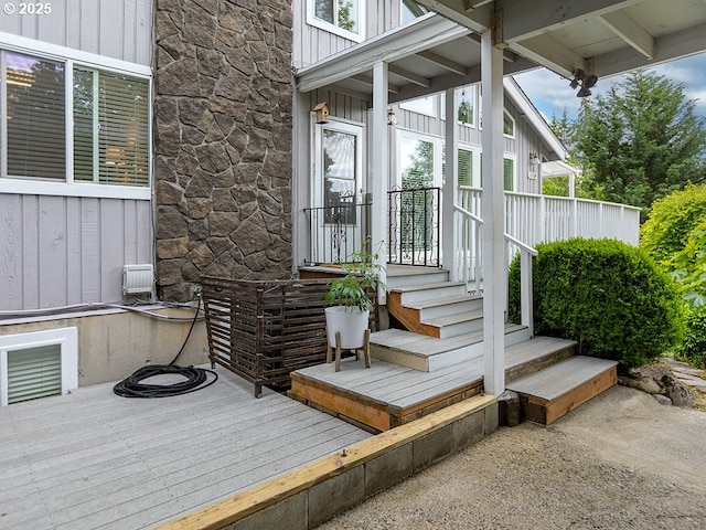 1339 NW 7th Ave, Camas, WA 98607 - view of exterior entry with stone siding, board and batten siding, and a wooden deck